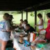 Pictured is club members and family enjoying the picnic feast.