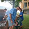 Pictured is Fred Hess (center) helping Bill Garrett (left) and Sandy Headley (right) with fixing the club picnic food on the grill.