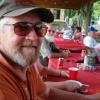 Club member Clyde Kelly smiling as he enjoy's the picnic.