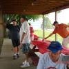 Club members after the picnic talk about fishing stories.