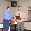 President Tom Lemley presents Bill Garrett with his "Top Six" plaque.