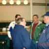 Ryan Harmon (left) talking to Tim Rhodes (right) before the banquet with President Rick Ferrell talking to Rick Vincent in the backgroung.