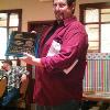 President Rick Ferrell 
shows his 
third place awards 
plaque for a photo shot.
